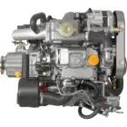 A detailed view of an engine with various components and hoses connected.