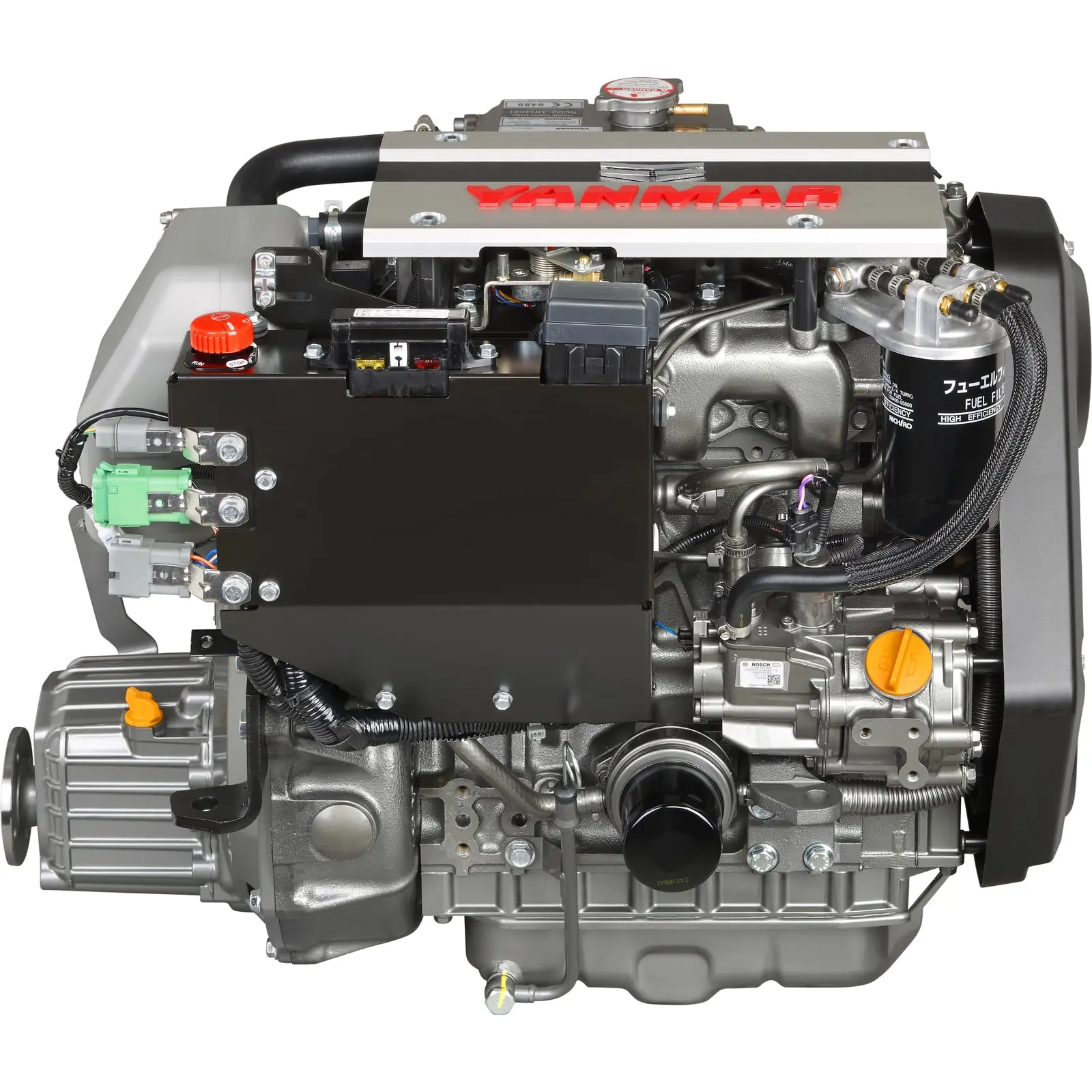 A Yanmar diesel engine with various components and hoses exposed.