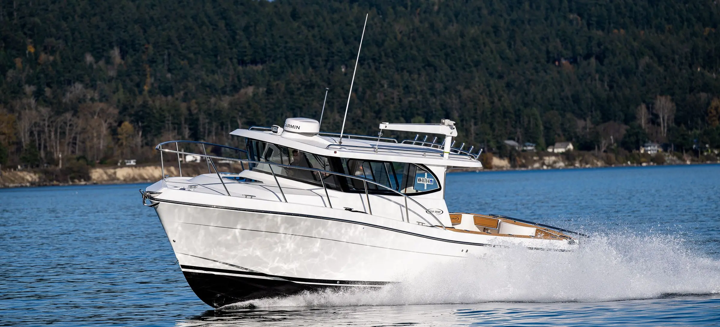 YANMAR-powered pilothouse boat running in open water